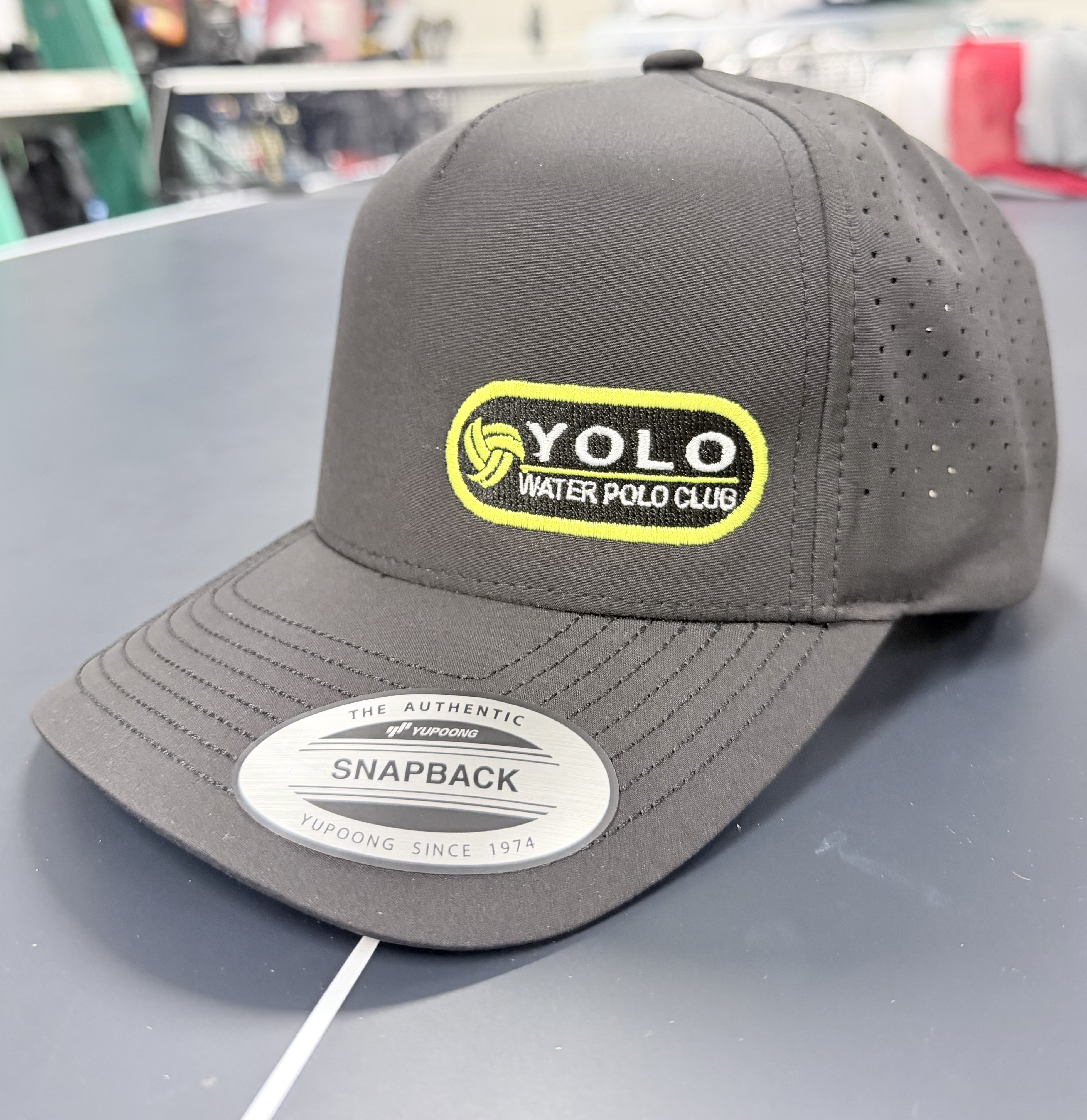 Yolo Polo Small Badge on Black Performance Hat