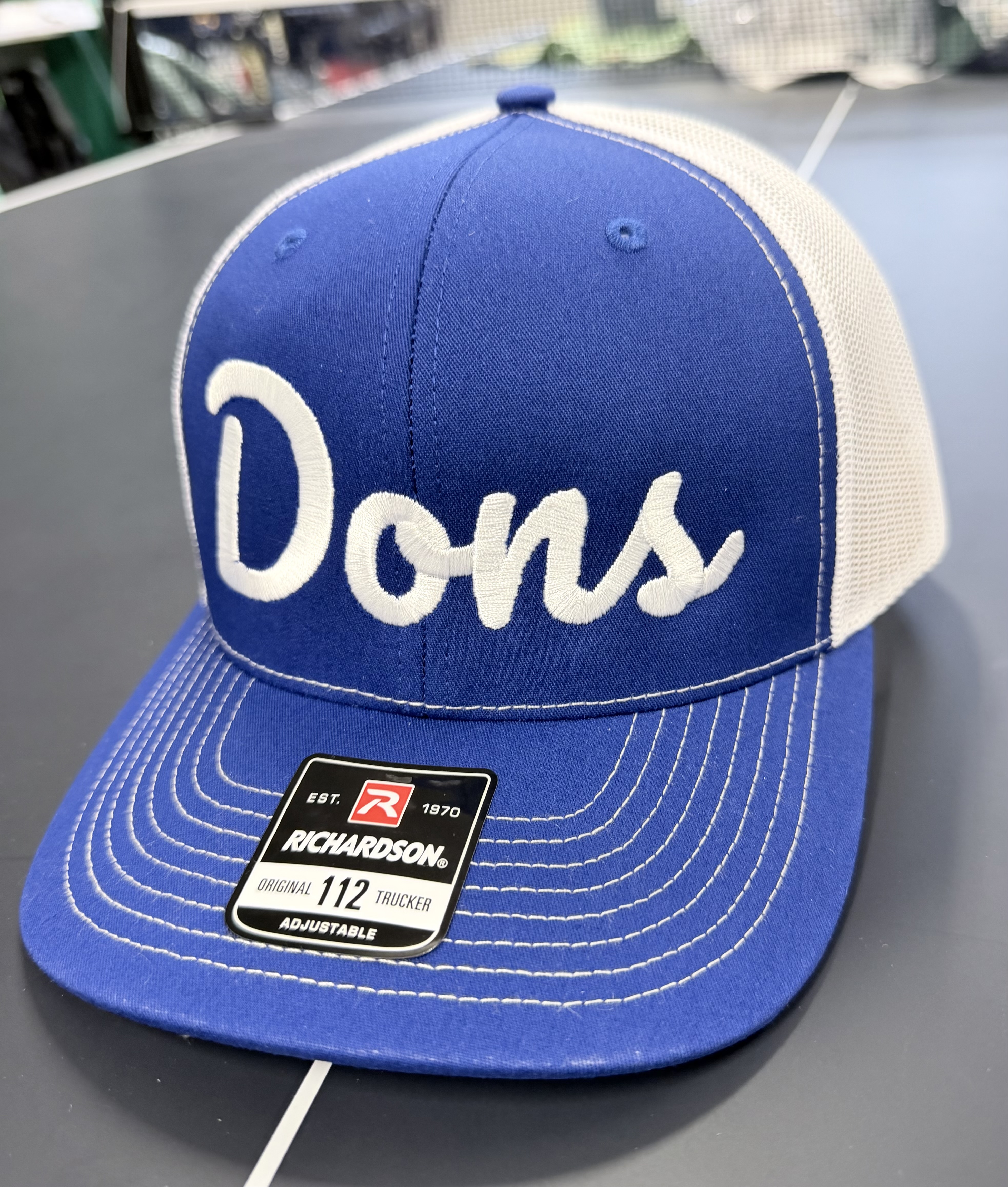 Dons script (blue)